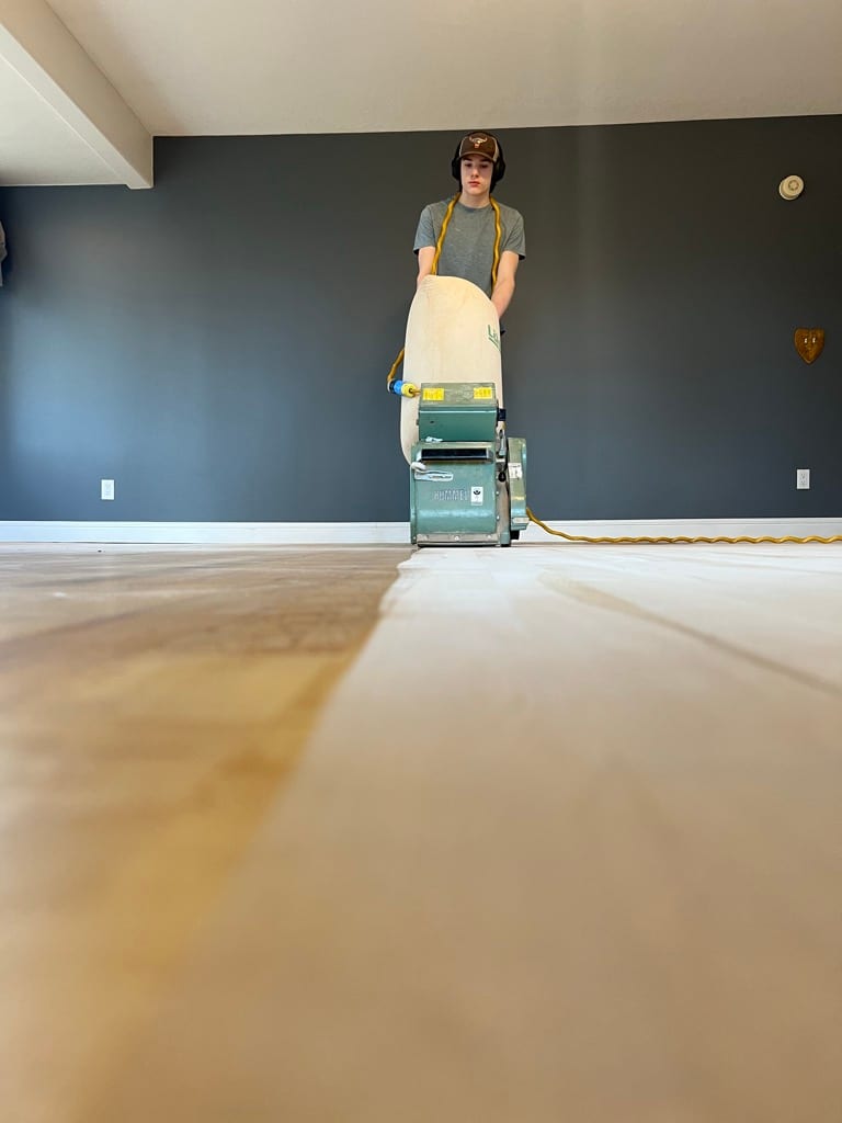Drum sander revealing fresh wood beneath worn finish, Coeur d’Alene Idaho