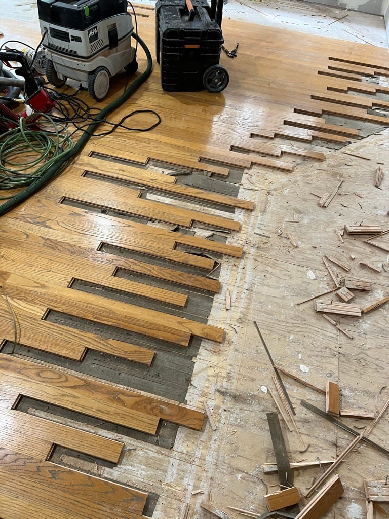Hardwood floor board replacement repair in progress, Coeur d’Alene Idaho