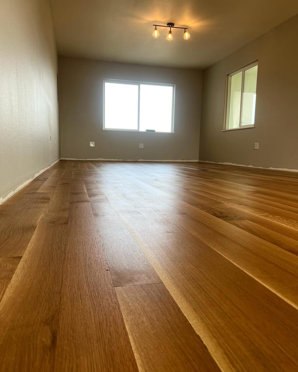 White oak wide-plank hardwood floor with large windows, Hayden Idaho