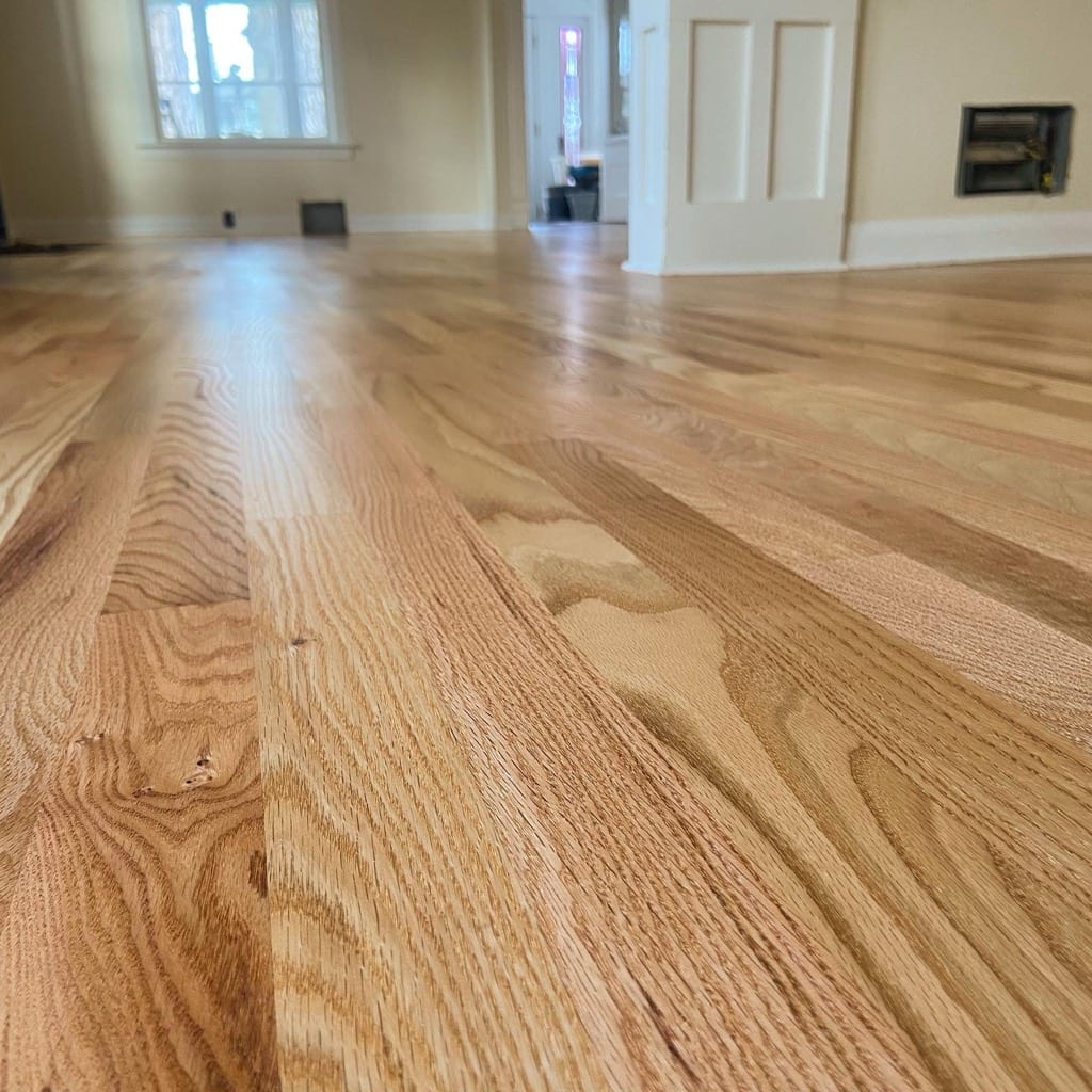 Wide open living room with newly refinished red oak hardwood floor, Hayden Idaho