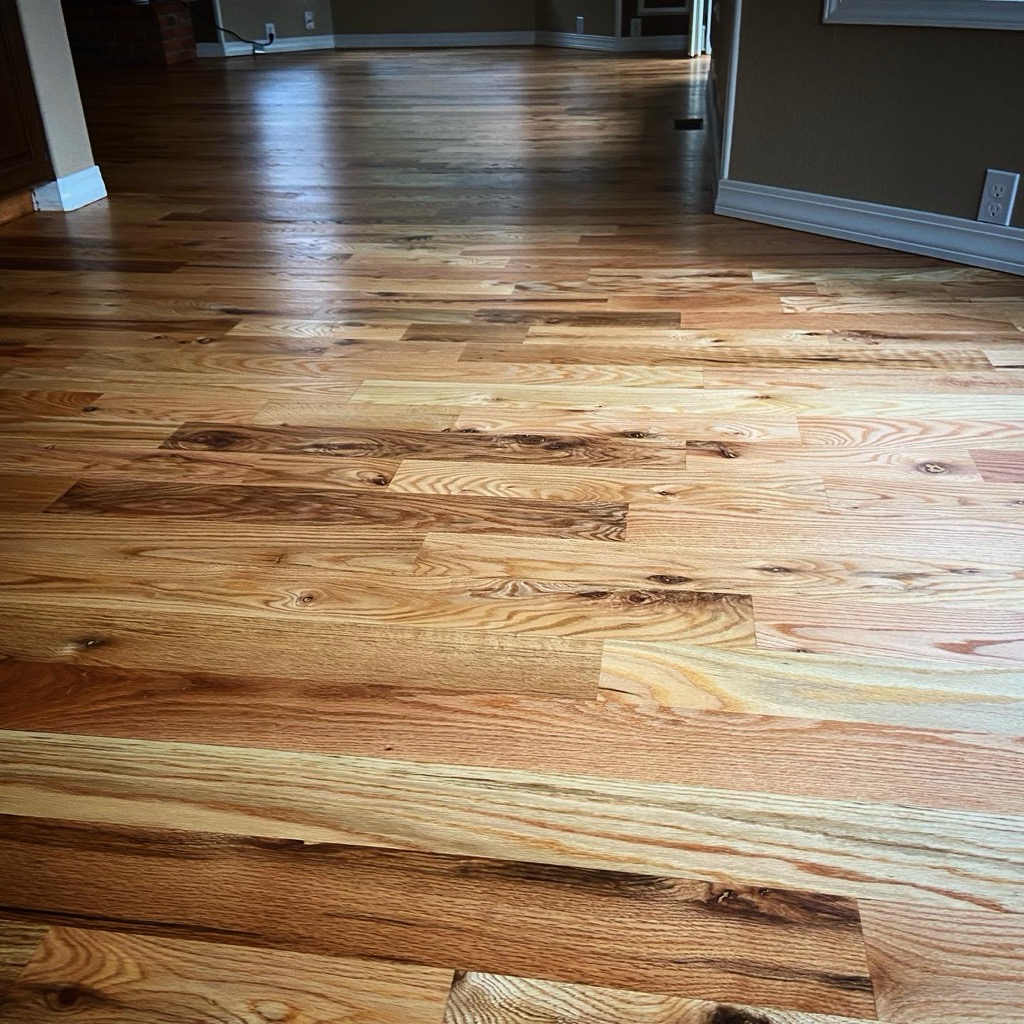 Smooth site-finished hardwood floor