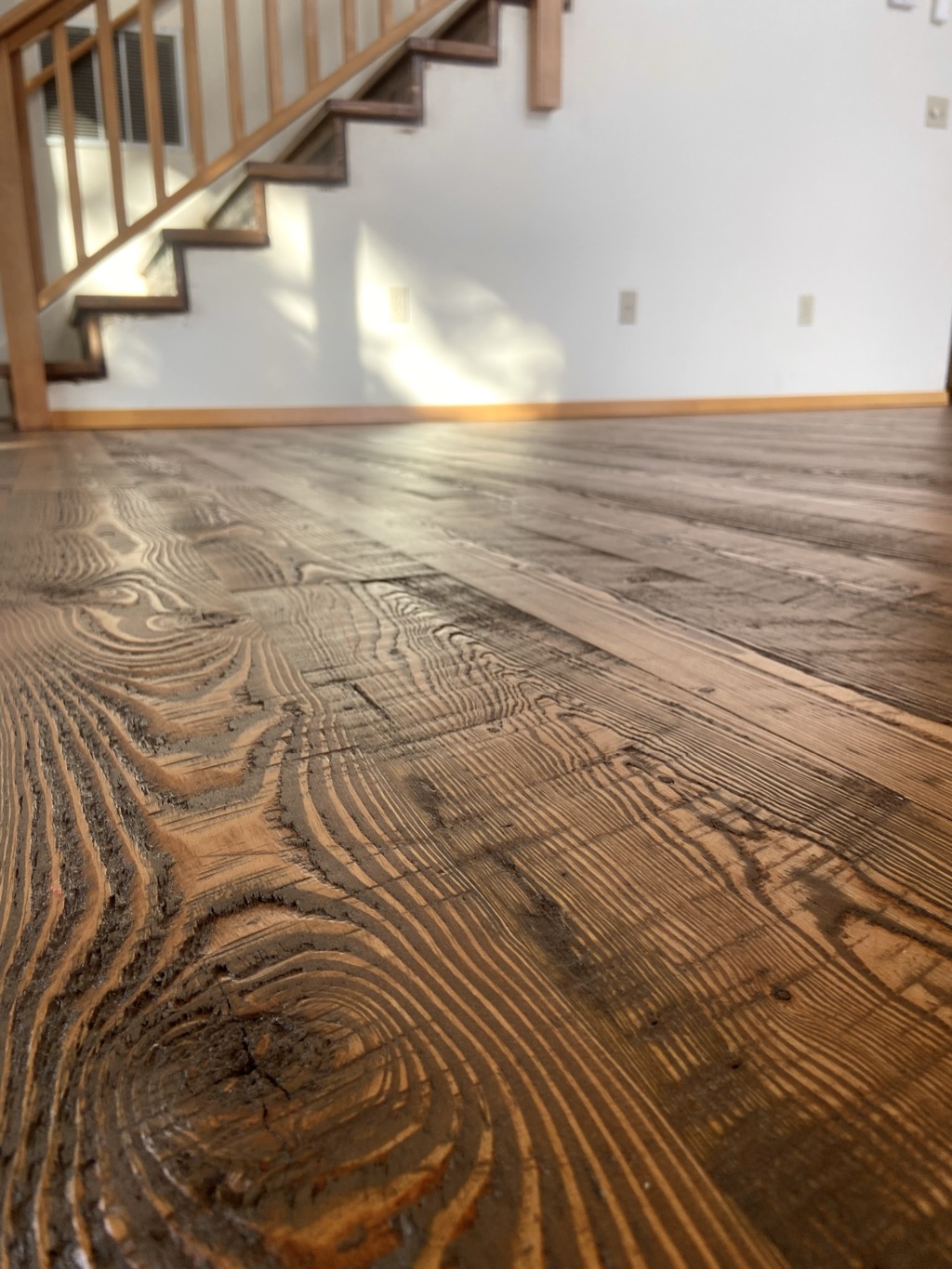 Wire-brushed hardwood floor with raised grain texture
